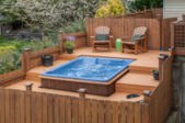 a hot tub with surrounding deck