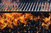 flaming charcoal under a grill
