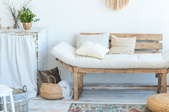 relaxing rustic design including wooden couch with covered cushions