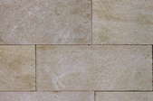 A back drop of natural stone tile.