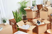 moving boxes with things piled into them