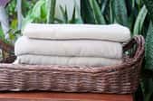 folded towels in a basket