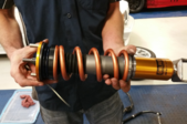 man holding a shock absorber