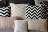 pillows with various designs, some in zig zags