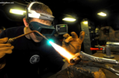 a man welding a metal part