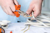 hands clipping wire with cutting tool