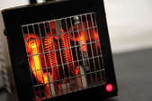 Radiant space heater with warm coils