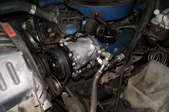 AC compressor alongside other engine parts