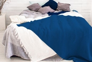 A bed with an electric blanket.