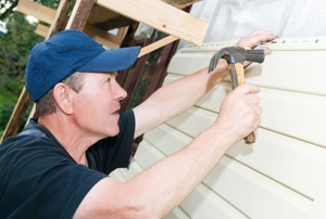 Man installing siding