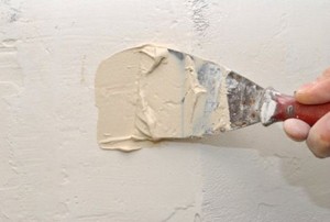The application of joint compound.