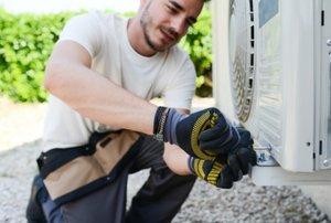 Repairman working on an air conditioner