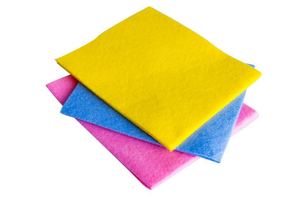a stack of pink, blue, and yellow cloths