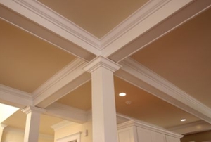 A warm, decorative ceiling in a home.