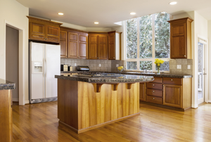 island in the center of a large, wood kitchen