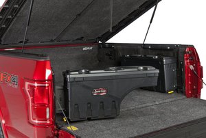 red truck with its bed cover flipped up