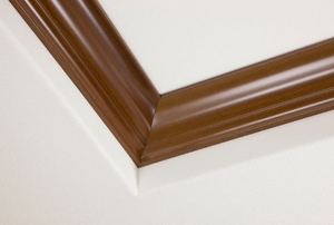 White ceiling with brown crown molding