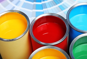 open cans of paint in a variety of bold colors