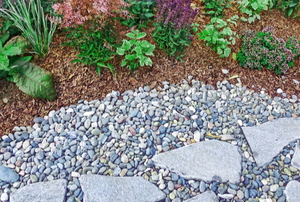 stones and gravel near a flower bed