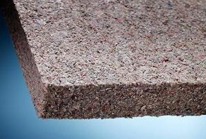 Extreme close-up of the corner of a piece of cellulose insulation.