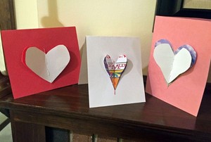 A trio of homemade Valentine's Day cards with 3-D hearts.