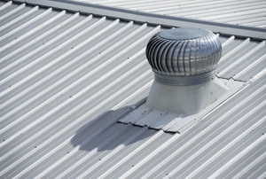 A roof vent on a metal roof.