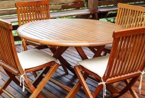 stained wooden outdoor chairs and table