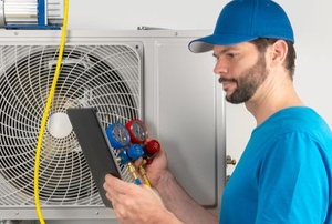 man evacuating air conditioning system with tools