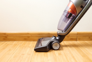 A vacuum on a wooden floor