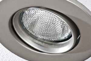 a ceiling spotlight lightbulb in a circular metal frame