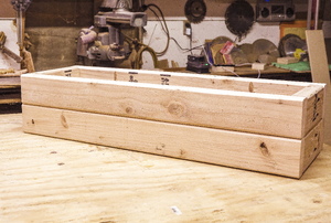 Completed wood planter box in a workshop