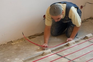 person working on a subfloor