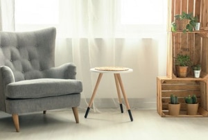 interior design with crates, chair, table, and curtain