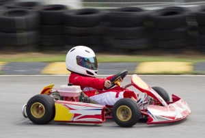 a person in a red go kart