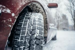 A car tire in snow.
