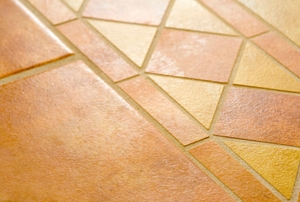A simple pattern made from ceramic tile on a floor.