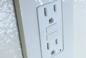 A GFCI outlet in a bathroom.