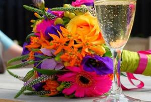 Homegrown bride's bouquet next to the all important glass of champagne.