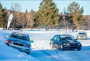 Cars on a road with snow.