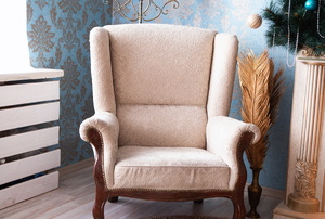A reupholstered armchair.