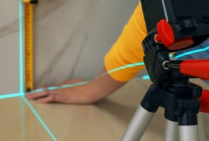 hands using laser measurement tool