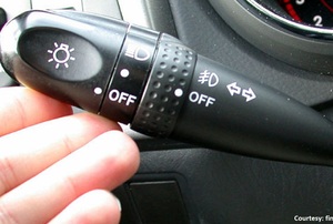 Hand on a turn signal lever