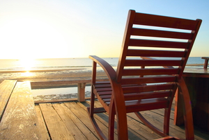 empty rocking chair on beach deck