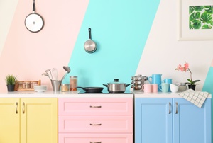 A yellow, pink and blue kitchen.