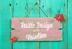 A distressed-looking wood sign with the words "rustic design with vaseline."