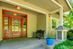 front porch with a stained fiberglass door