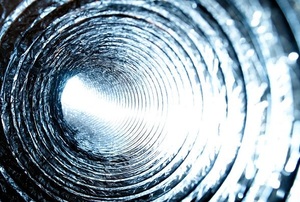 A close-up photo of the inside of a heating duct.