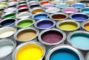 Cans containing various colors of paint.