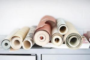 rolls of wallpaper in a pile