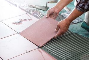 A floor being tiled.